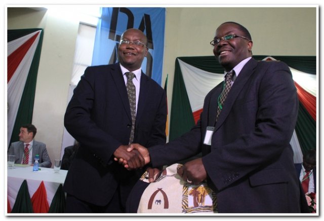 director ict handing over a  present to prof. too